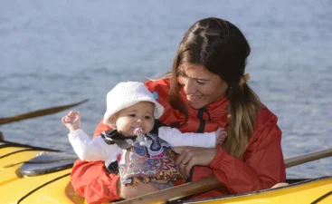 woman-and-infant-enjoying-a-boat-ride-2026-03-26-09-12-08-utc Parent boating with an infant