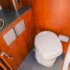 A compact toilet in a small bathroom