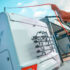 Person conducting caravan maintenance by washing their RV.